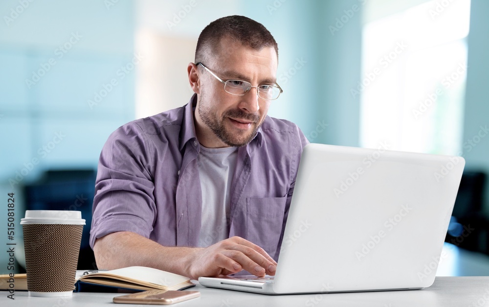 Modern Office Businessman or Manager Working on Computer,. Portrait of Successful IT Software Engineer Modern Office Businessman or Manager Working on Computer,. Portrait of Successful IT Software Engineer