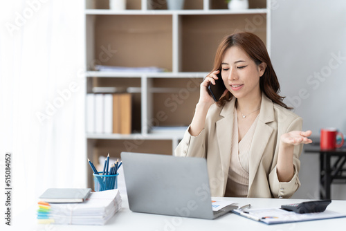 Wallpaper Mural Asian businesswoman in formal suit in office happy and cheerful during using smartphone and working. Torontodigital.ca