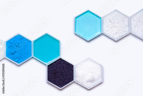 Chemical ingredient in hexagonal molecular shaped container. Sodium Thiosulfate, Copper (II) Sulfate, Shampoo, Potassium Permanganate, Sodium Hydroxide Pellets, Conditioner, Carbamide and Polyethylene photo