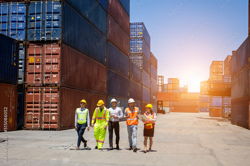 Group workers people in safety uniforms and hard hats work at logistics