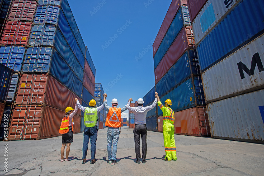 Group workers people in safety uniforms and hard hats work at logistics