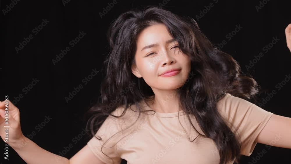 Attractive Asian woman dancing and being playful. Slow Motion. Attractive Asian woman dancing and being playful. Slow Motion.