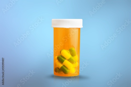 White pills in RX prescription drug bottle photo