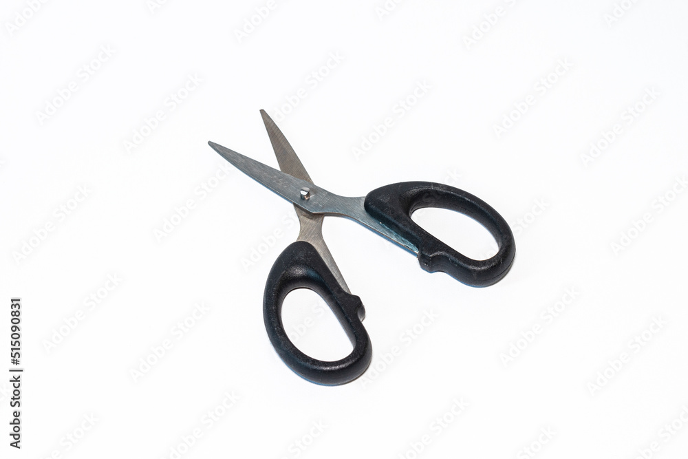 stainless steel scissor with black handle grip isolated white background stainless steel scissor with black handle grip isolated white background