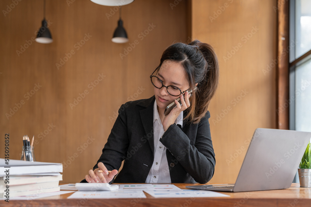 Fototapeta premium Busy business accountant woman making call phone in office and business working background, tax, accounting, statistics and analytic research concept