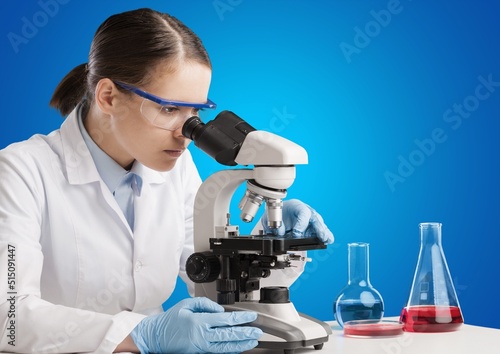 Students working in the clinical laboratory, a researcher is using a microscope, scientific research concept