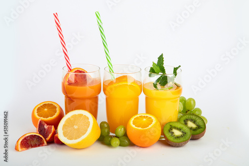 Fruit juices assortment on light background.
