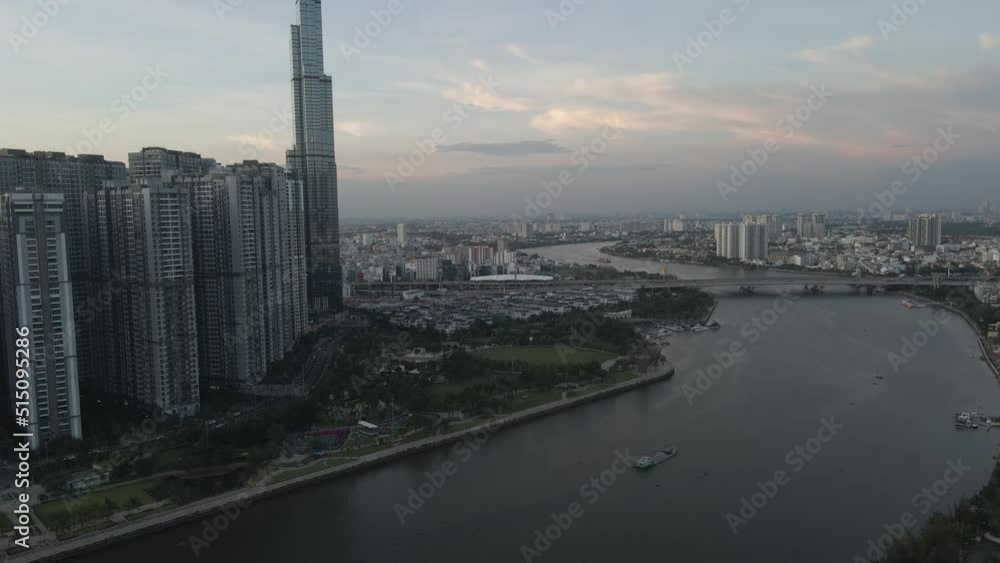 Ho Chi Minh City, Vietnam, Aerial Hyperlapse View of Downtown Skyscrapers and Riverfront at Twilight, Drone Shot Ho Chi Minh City, Vietnam, Aerial Hyperlapse View of Downtown Skyscrapers and Riverfront at Twilight, Drone Shot