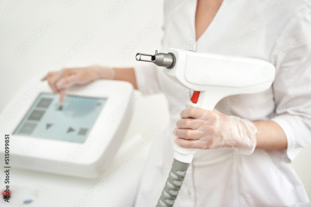 Laser hair removal treatment. Clinic skin care procedure. Medical  dermatology photo equipment. People epilation device. Cosmetology  technology salon epilation. Body aesthetic concept. Doctor holding Photos |  Adobe Stock