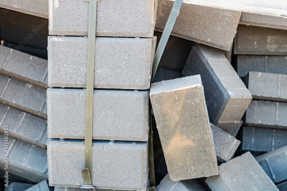 Loose paving slabs prepared for laying at the construction site. Laying