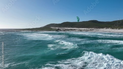 Massive Slow Motion Kiteloop Performed on big Waves by a Kitesurfer on a Summer Day