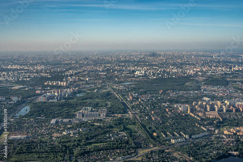 Aerial view photo from airplane of city and clear sky. aerial photo of large city from an airplane window. view of city of Moscow through window from plane © Celt Studio