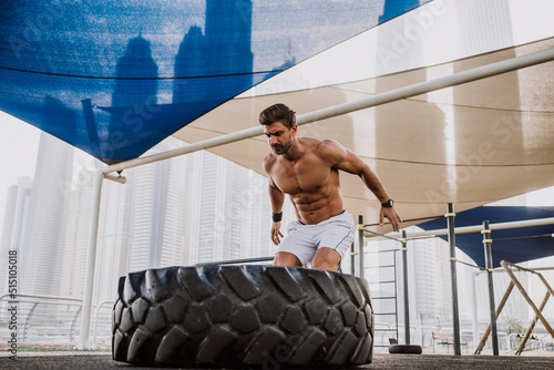 Photography Handsome young man making functional training outdoor in the city