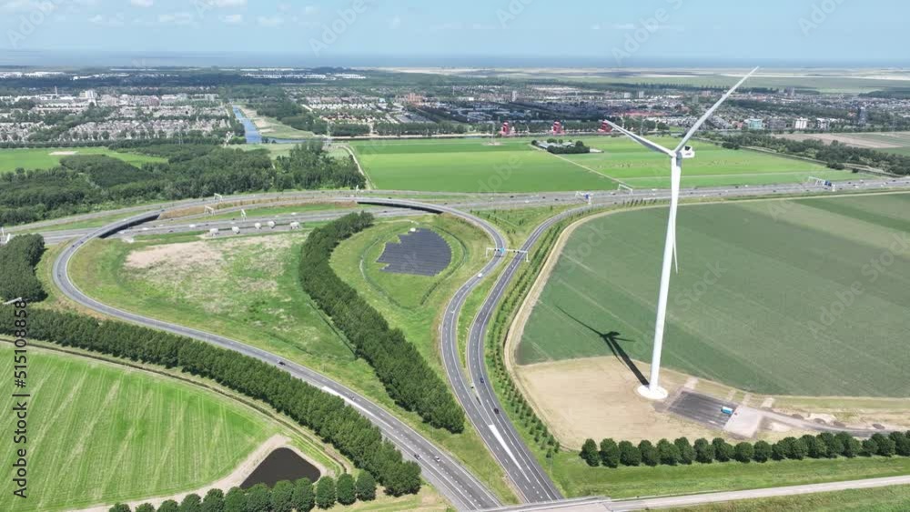 Wind turbine system sustainable energy generation on a wind farm in the countryside. Clean green renewable energy generation infrastructure and solar panels. Wind turbine system sustainable energy generation on a wind farm in the countryside. Clean green renewable energy generation infrastructure and solar panels.