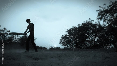 Indian local cricket team play cricket in ground silhouette view, close up,village Indian boys are playing Gully Cricket
