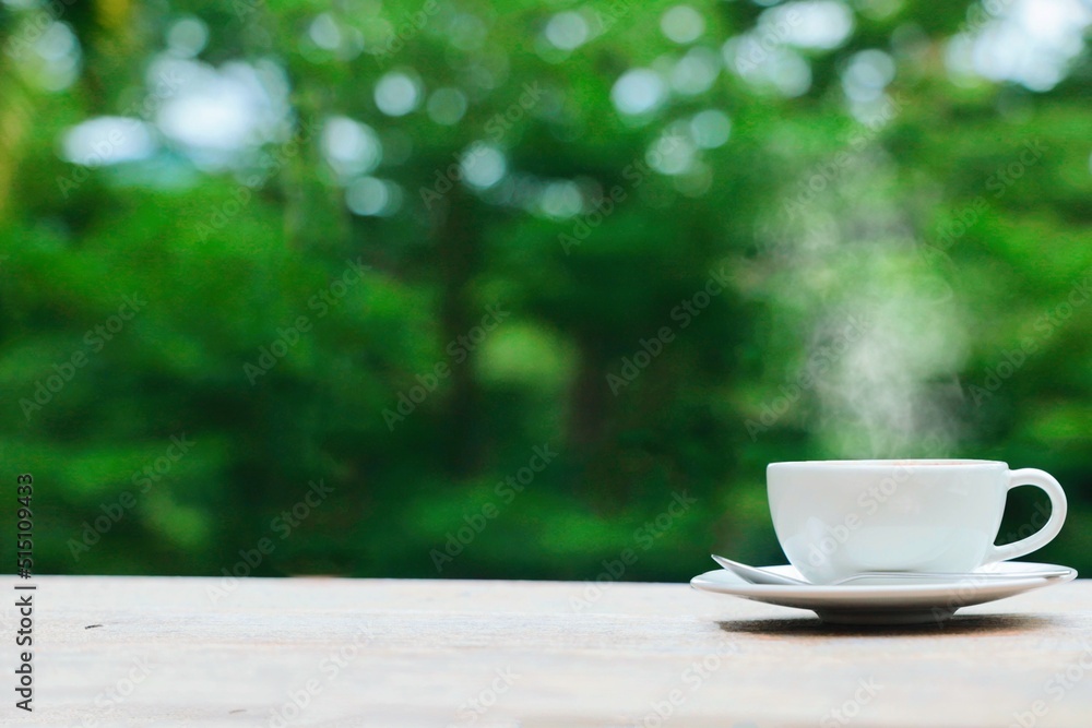cup of coffee on wooden table cup of coffee on wooden table