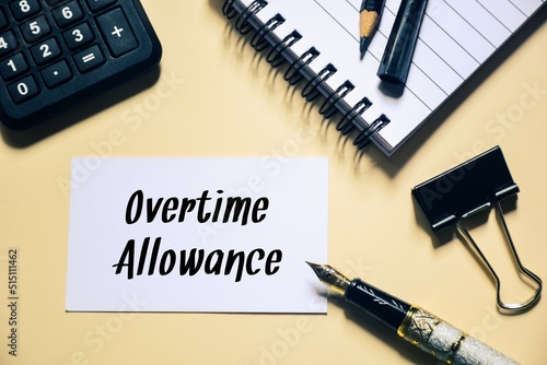 Card with the text Overtime allowance on office desk. Business concept. photo