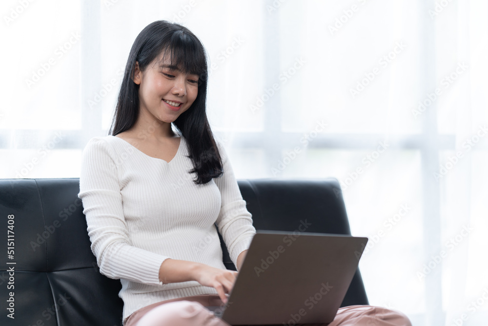 Asian woman working with laptop in her office. business financial concept. Asian woman working with laptop in her office. business financial concept.