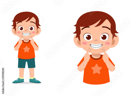 little kid using dental braces and feel happy