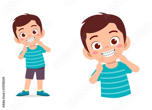 little kid using dental braces and feel happy