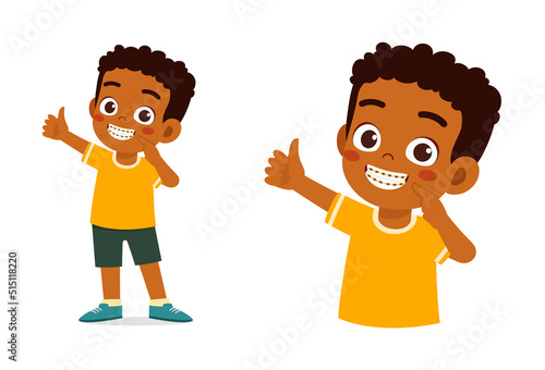 little kid using dental braces and feel happy