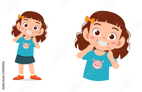 little kid using dental braces and feel happy
