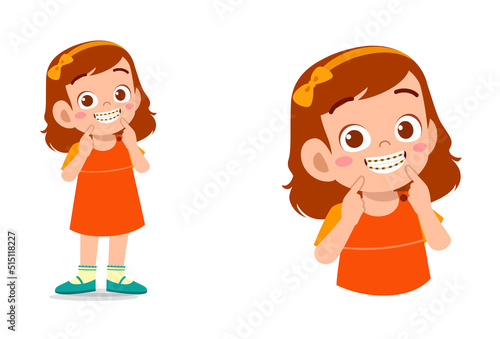 little kid using dental braces and feel happy