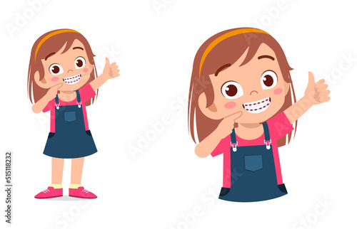 little kid using dental braces and feel happy