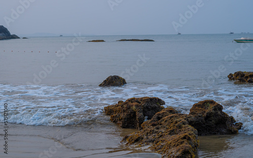 mossy grass on rocks near seashore photo