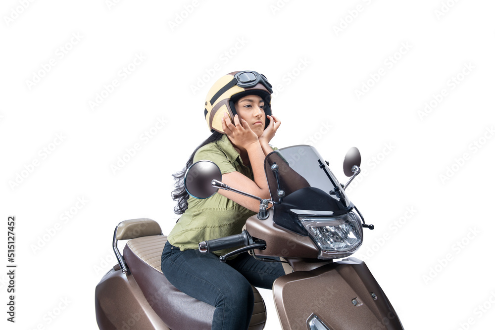 Asian woman with a helmet sitting on a scooter Asian woman with a helmet sitting on a scooter