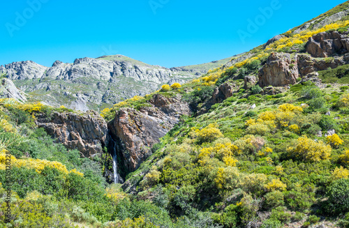 La catarata de Mazobre en pleno parque natural de la montaña Palentina durante un día de verano, España photo