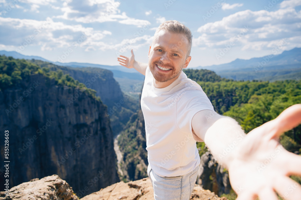 Happy man tourist make selfie photo background of sunset in mountain Tazi canyon in Manavgat Antalya Turkey