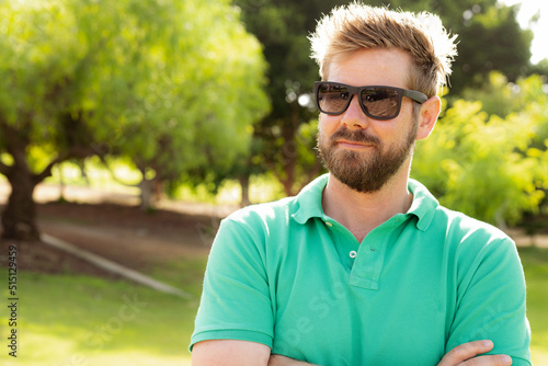 Close up portrait of a handsome young man wearing sunglasses outdoor