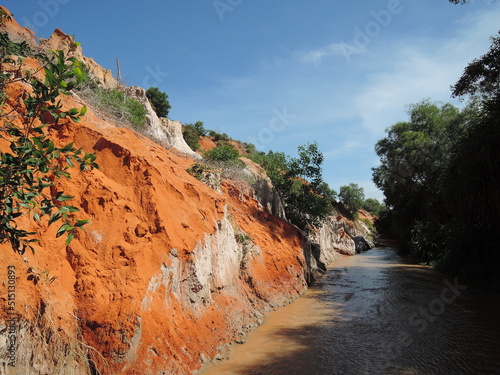 Fairy Stream Canyon,The muddy waters of the Fairy River(Suoi Tien), Tropical oasis scenery of hills with limestone,sandstone plateaux,geological formation.Popular and famous landmark in Mui Ne,Vietnam photo