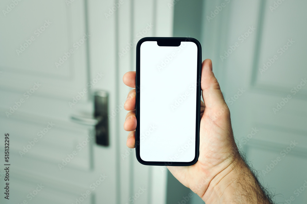 Male hand using smartphone app to unlock apartment door, smart home concept mockup Male hand using smartphone app to unlock apartment door, smart home concept mockup