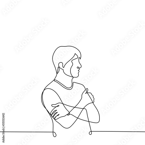 man stands with his hands hugging his shoulders - one line drawing vector. male profile portrait. the concept of self-rescue, self-complacency, insecurity, cold