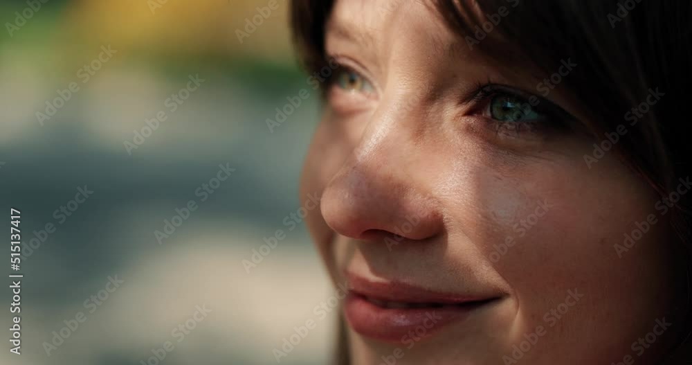 Happy girl opening eyes and enjoying sunny weather outdoors Happy girl opening eyes and enjoying sunny weather outdoors