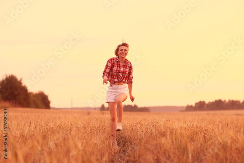 girl runs through an agricultural field summer © kichigin19