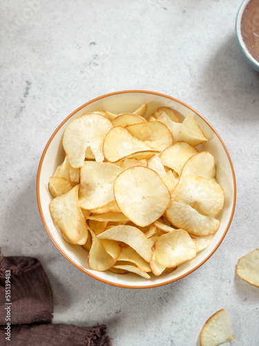 Keripik singkong. Cassava chips or tapioca chips is traditional snack from Java, made of cassava thinly sliced and fried.