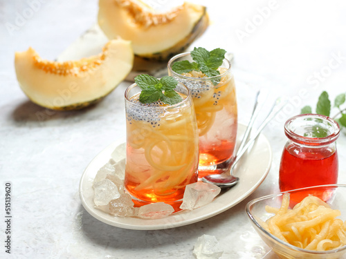 Es Blewah. Indonesian cold fruity drink of cantaloupe strips with syrup, basil seeds on top