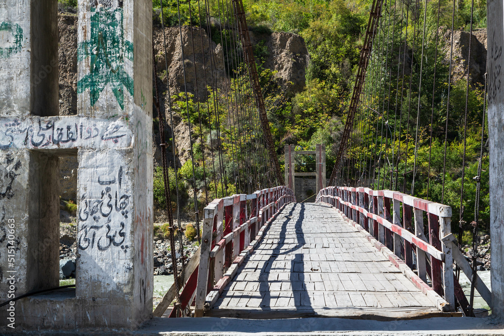 Fototapeta premium Wooden bridge over Hunza River in Hunza valley, Gilgit-Baltistan, Pakistan
