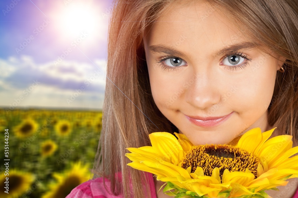 Happy little child walking in field of sunflowers. Child playing with big flower and having fun. Kid exploring nature. Happy little child walking in field of sunflowers. Child playing with big flower and having fun. Kid exploring nature.
