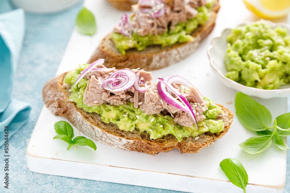 Toasts with canned tuna and avocado guacamole. Healthy food, diet breakfast