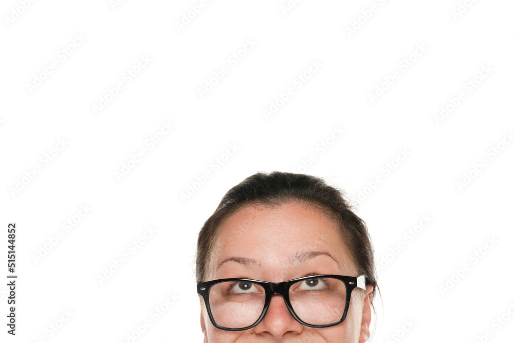 half portrait of a young chubby woman with glasses looking up half portrait of a young chubby woman with glasses looking up
