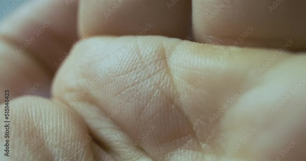 Rred laser dot passes through the palm of a human hand. The concept of point skin scanning, microsurgery, medicine, diagnostics. Rred laser dot passes through the palm of a human hand. The concept of point skin scanning, microsurgery, medicine, diagnostics.