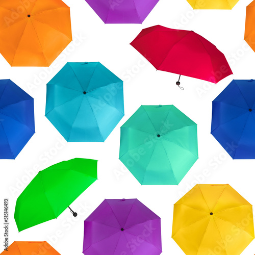 Seamless pattern of different colors colorful umbrellas isolated on white background © MadGladNat