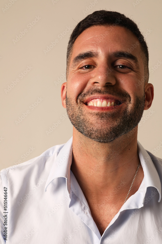 Portrait of bearded optimistic young man on white background. Vertical mock-up. Portrait of bearded optimistic young man on white background. Vertical mock-up.