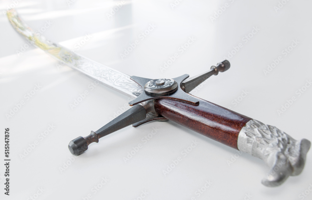 Obraz premium Cossack saber on white table, selective focus