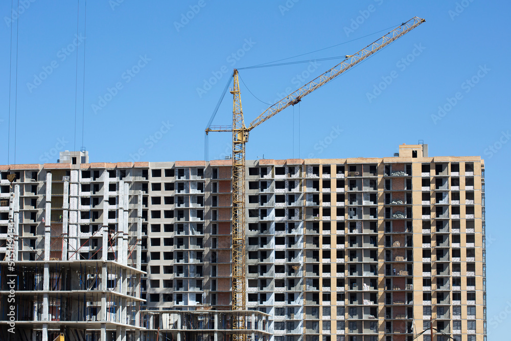 Construction site background. Cranes and new high-rise buildings. Construction and industry concept.