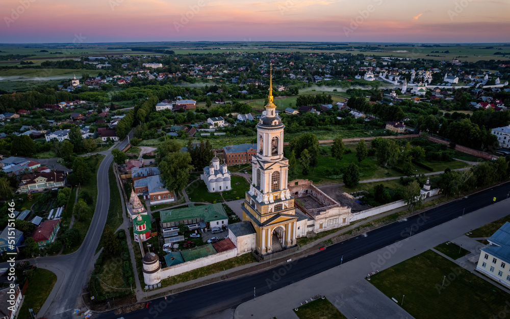 Fototapeta premium Aerial views of Russian Golden Ring town Suzdal on a sunrise (aerial drone photo). Suzdal, Russia